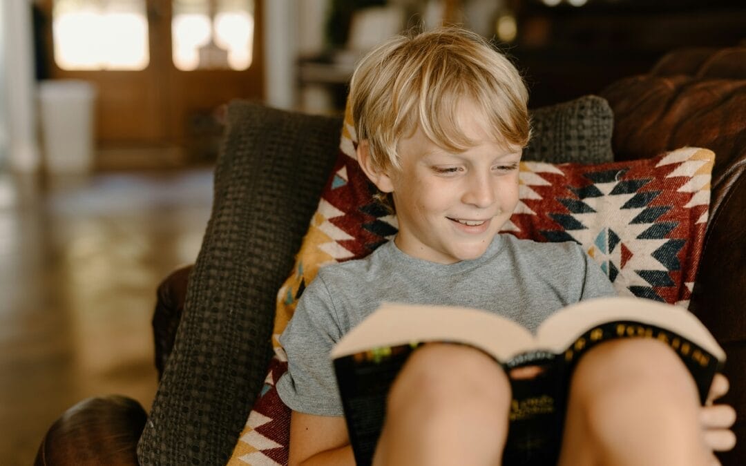 little boy reading a book